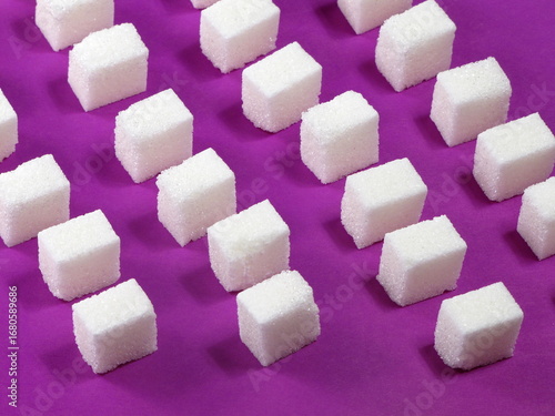 sugar cubes on a colored background.