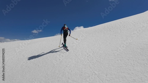 Mountaineering skier climbs alone