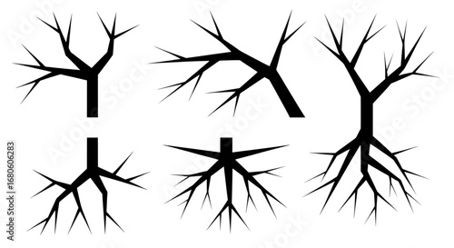 A collection of black dead tree and root silhouettes. Spooky, sharp vector icons isolated on a white background, perfect for Halloween or horror themes.