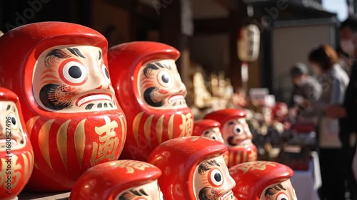 Vibrant Red Daruma Dolls a Tightly Packed Display of Japanese Traditional Culture Featuring Golden Embellishments and Rich Artistic Detail Eye Level View