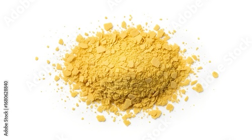 A close-up, top-down view of a pile of nutritional yeast flakes isolated on white.