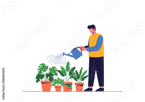 Young man watering houseplants in pots on a sunny day at home enjoying his hobby