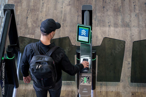 Passenger scanning QR code at airport boarding gate for check-in and flight access