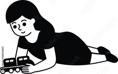 Girl playing with a toy train on the floor
