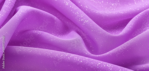 Close-up of a draped light purple fabric with soft folds and subtle texture, creating a refined composition with elegance, depth, and artistic visual appeal.