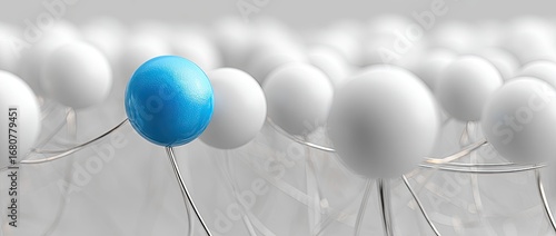 A single blue sphere amidst many white ones