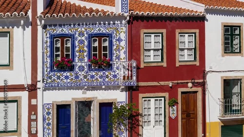 Vibrantly Painted Dwellings Along Coastal Beach in Traditional Western European Fishing Locale