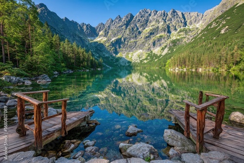 Fototapeta Naklejka Na Ścianę i Meble -  Serene mountain lake reflected in crystal-clear water