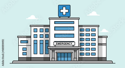 A modern hospital building featuring an emergency entrance and a prominent cross symbol, representing essential healthcare services and medical facilities.