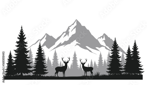 Majestic snow capped mountains rise behind a silhouette of a dense evergreen forest with two deer standing peacefully in a clearing