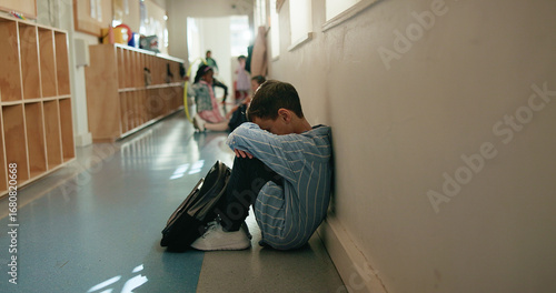 Canvastavla Boy, sad and depressed in corridor at school, alone and social isolation with mental health on floor