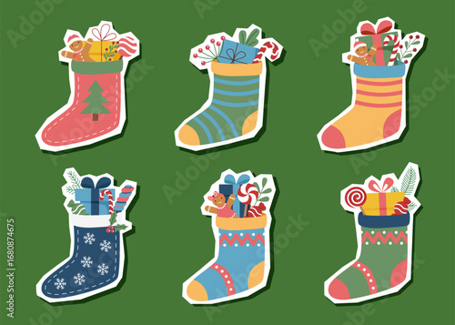 Set of Christmas stockings with gifts isolated on white background. Vector flat cliparts.