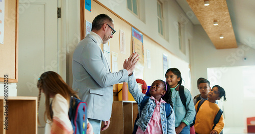 Photos Teacher, children and high five greeting at school for welcome to classroom for education
