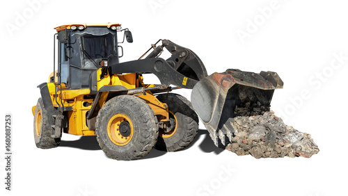Bright yellow loader bulldozer is actively transporting construction debris, showing its powerful front loader in action at a isolated background.