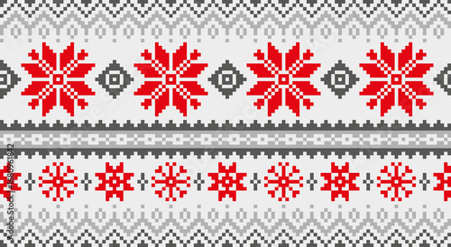 Winter Christmas knitted pattern with snowflake motif. Traditional knitting and embroidery. Design for banner, card, print, fabric, background.
