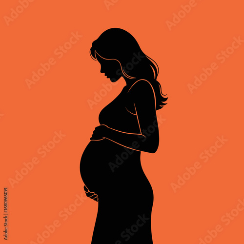 Beautiful silhouette of a pregnant woman holding her belly in profile against a bright orange background representing hope and new beginnings