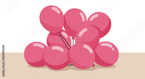 A cluster of bright pink balloons tied together with a silver string on a light brown surface