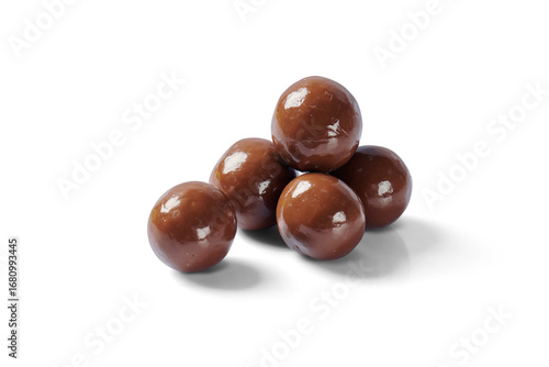 Pile of round chocolate covered nougat cream filled waffle balls candy sweet