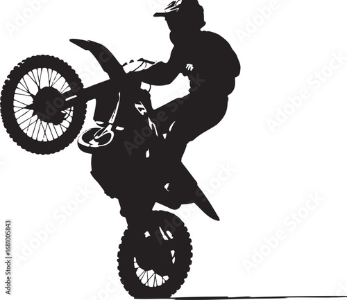 Black silhouette of motorbike rider performing wheelie stunt