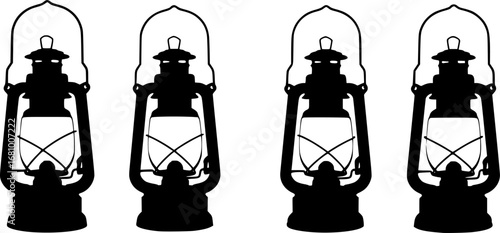 Four vintage kerosene oil lanterns arranged in a row silhouette
