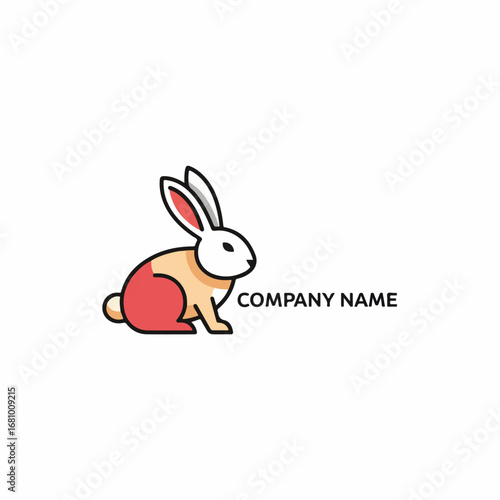 Adorable baby rabbit with soft fluffy fur sitting calmly in a beautiful spring garden.