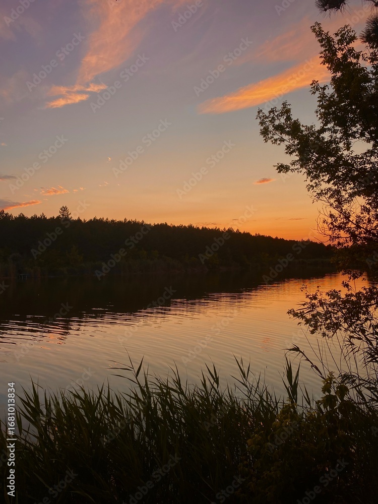 Naklejka premium sunset over the river