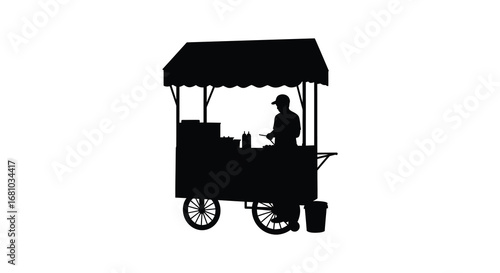 Silhouette of a vendor selling food from a push cart with canopy