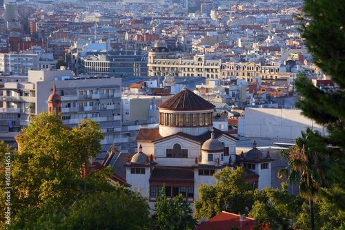 Cityscape of El Poble-sec and Sant Antoni district of Barcelona city, Spain. Mercat de les Flors dance theatre building in foreground.