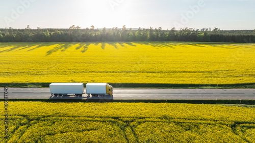 High angle view of truck moving on road surrounded by field