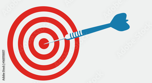 Blue dart perfectly hitting the bullseye on a red and white circular target board representing success