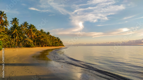 A breathtaking sunset unfolds over Bainema Beach, one of the hidden treasures of Boipeba Island in Bahia, Brazil.