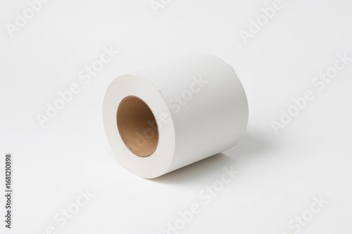 Hollow center of a tissue paper tube. Unused cardboard tube from toilet tissue shown against a plain white backdrop.