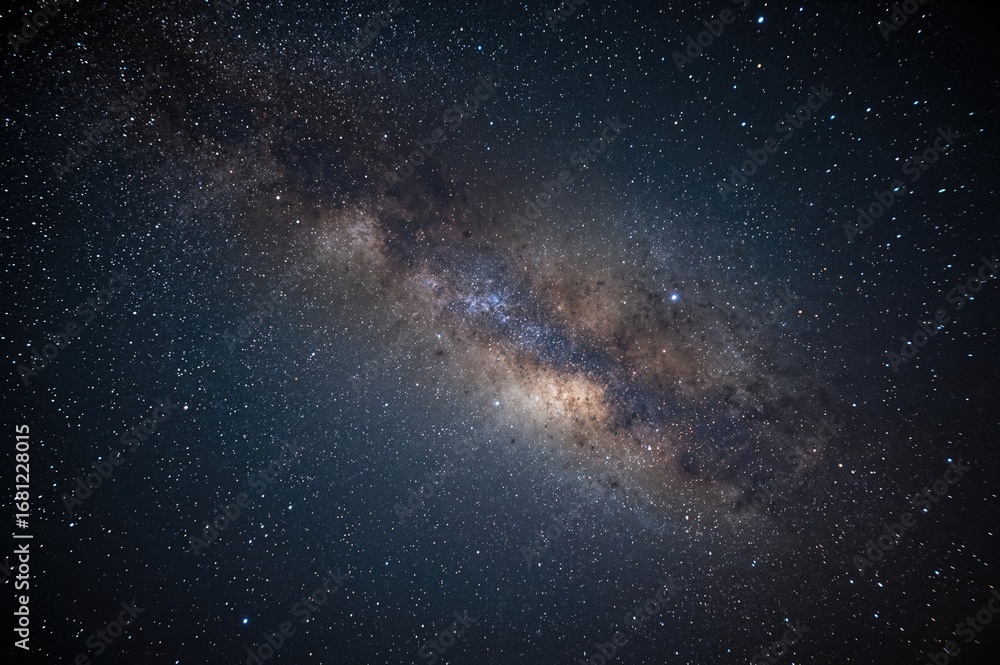 Fototapeta premium Night sky filled with stars, the Milky Way, and far-off galaxies