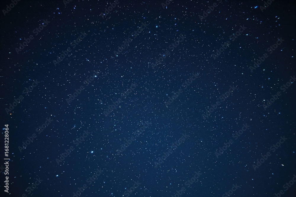 Fototapeta premium A magnificent night sky filled with innumerable stars, visible in secluded locations free from light interference, showcasing a mesmerizing cosmic panorama.