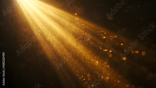 Cinematic and ethereal abstract background of golden light rays and sparkling dust particles on a black background