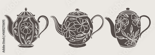 Set of teapot silhouettes with floral ornament. Hand drawn illustration.