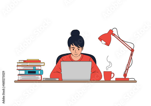Focused student working diligently on laptop surrounded by books and study materials