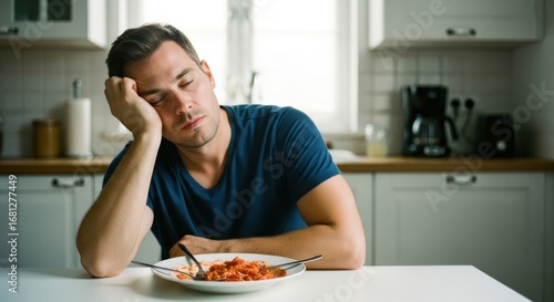 Tired man, empty plate, kitchen