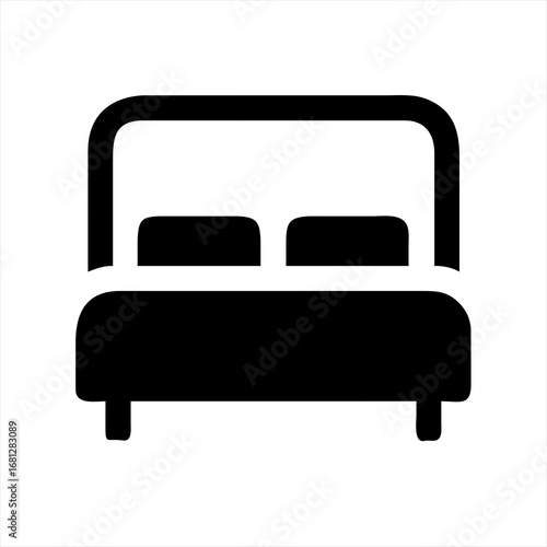 Simple black icon of a double bed with headboard