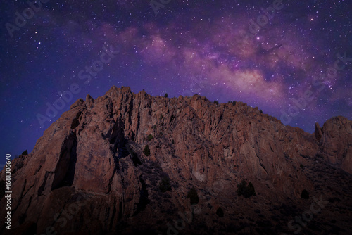 Milky Way core over mountains  and desert landscape	