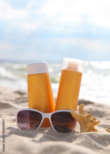 Wallpaper Mural Sunscreens on the beach near the sea close up. Vertical photo format Torontodigital.ca