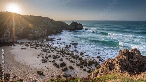 Fototapeta Naklejka Na Ścianę i Meble -  Coastal rocks by the ocean with sunlit waves and beach views