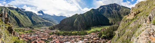 Wallpaper Mural Panoramic view with the town of Ollantaytambo surrounded by the majestic Andes Mountains in the Sacred Valley of Peru. Torontodigital.ca