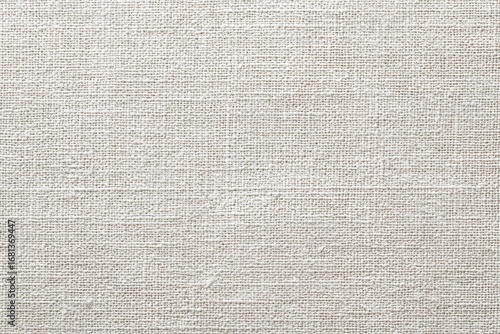 Close-up view of a light beige linen fabric texture