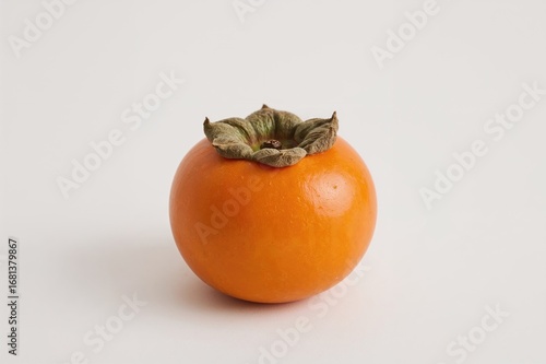 Single persimmon fruit on a...
