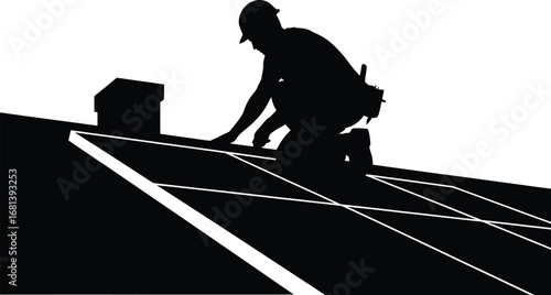 Silhouette of a roofer installing solar panels on a rooftop