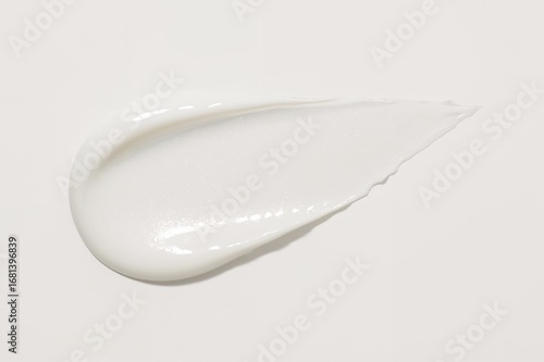 Swatch of white cosmetic cream on surface