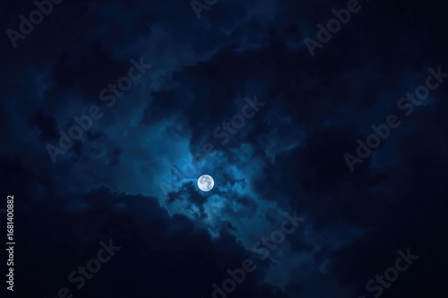 Wallpaper Mural Dramatic vertical night scene featuring layered blue tones, a faint moon, and a tiny bright cloud highlight Torontodigital.ca