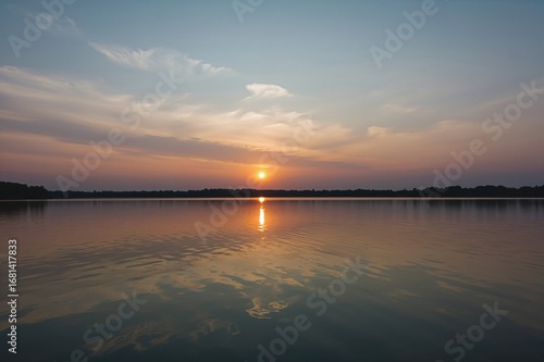 Wallpaper Mural Scenic view of a tranquil lake at dawn or dusk with vibrant sky colors mirrored in the water surface, ample space for text. Torontodigital.ca
