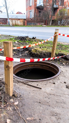 Open manhole on a city street